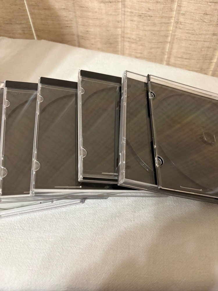 Plastic Disk Storage Shelf With 7 Pre-Owned Plastic Disk Cases