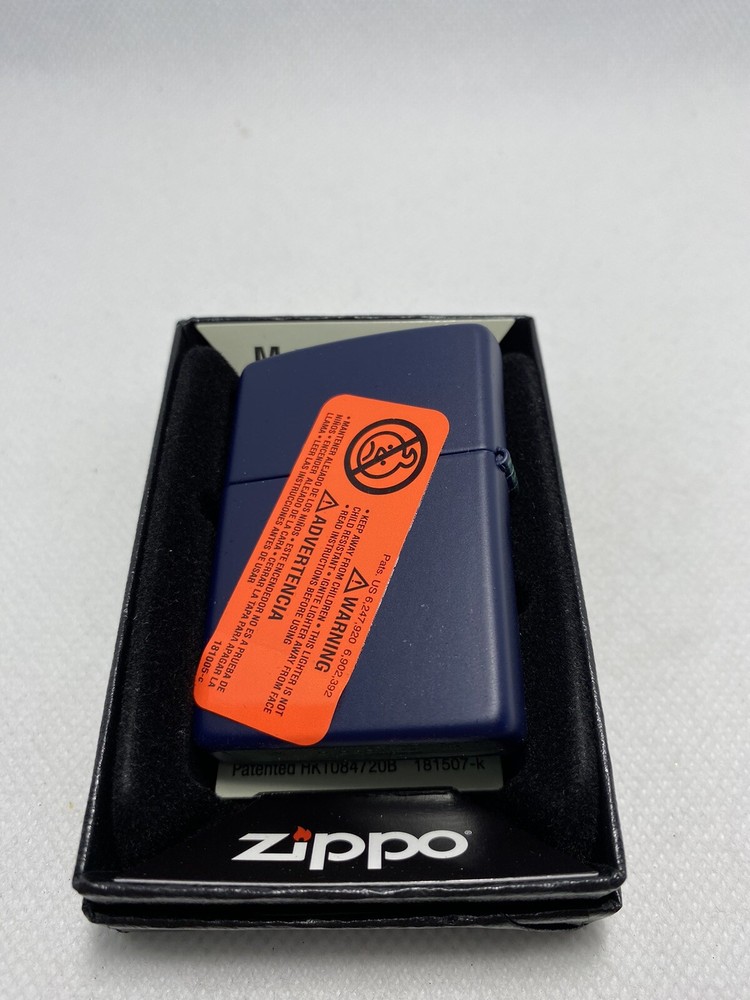 Zippo Compass On A Navy Blue Lighter