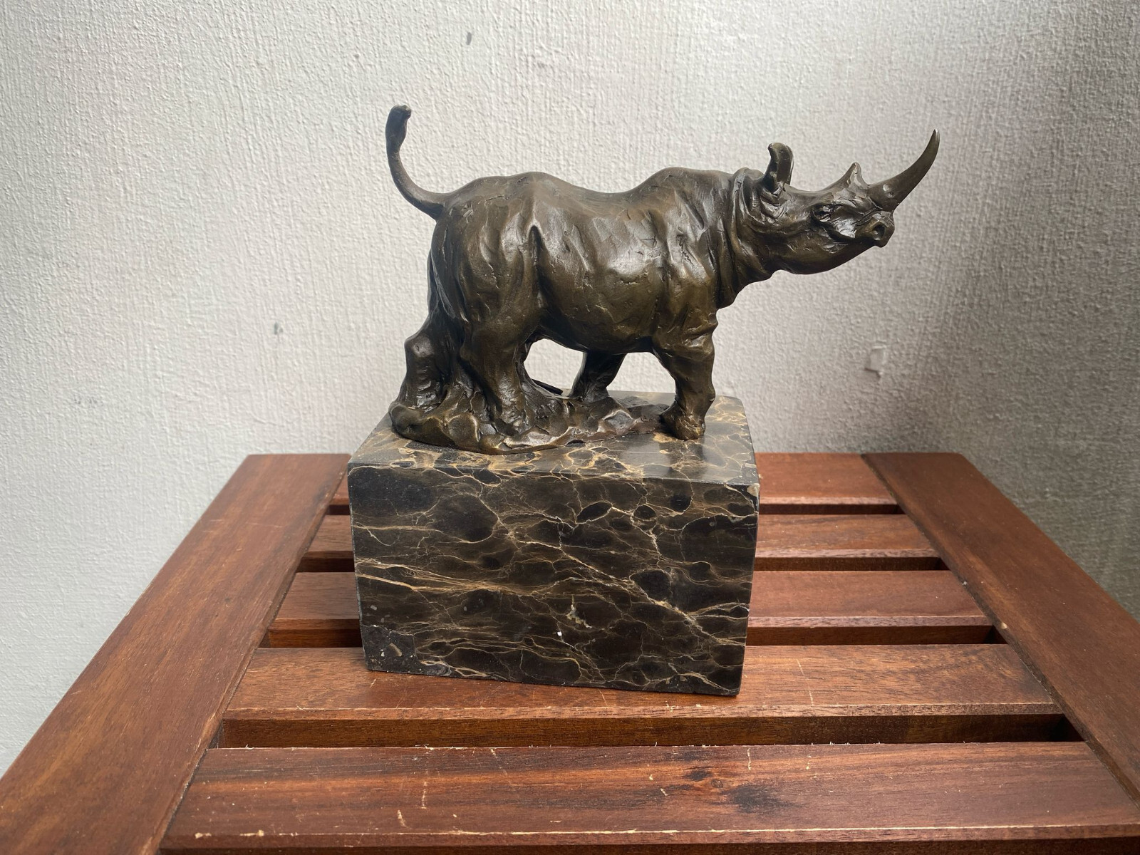 Bronze sculpture  Walking Rhinoceros on a black marble base after Milo