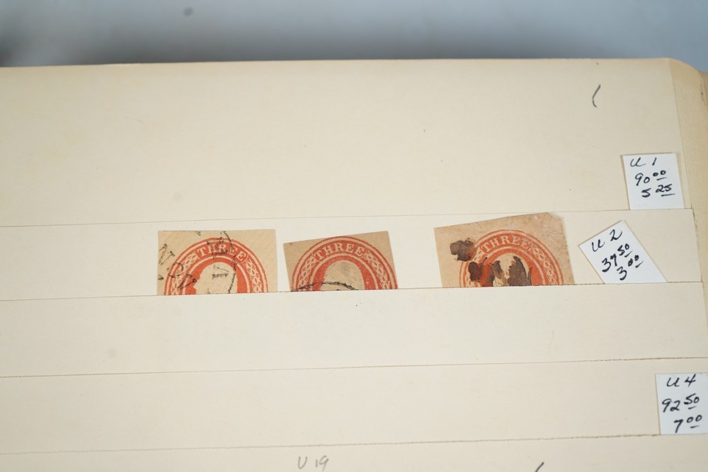 US COLLECTION OF 1,200+ STATIONERY CUT SQUARE STAMPS STORED IN STOCKBOOK