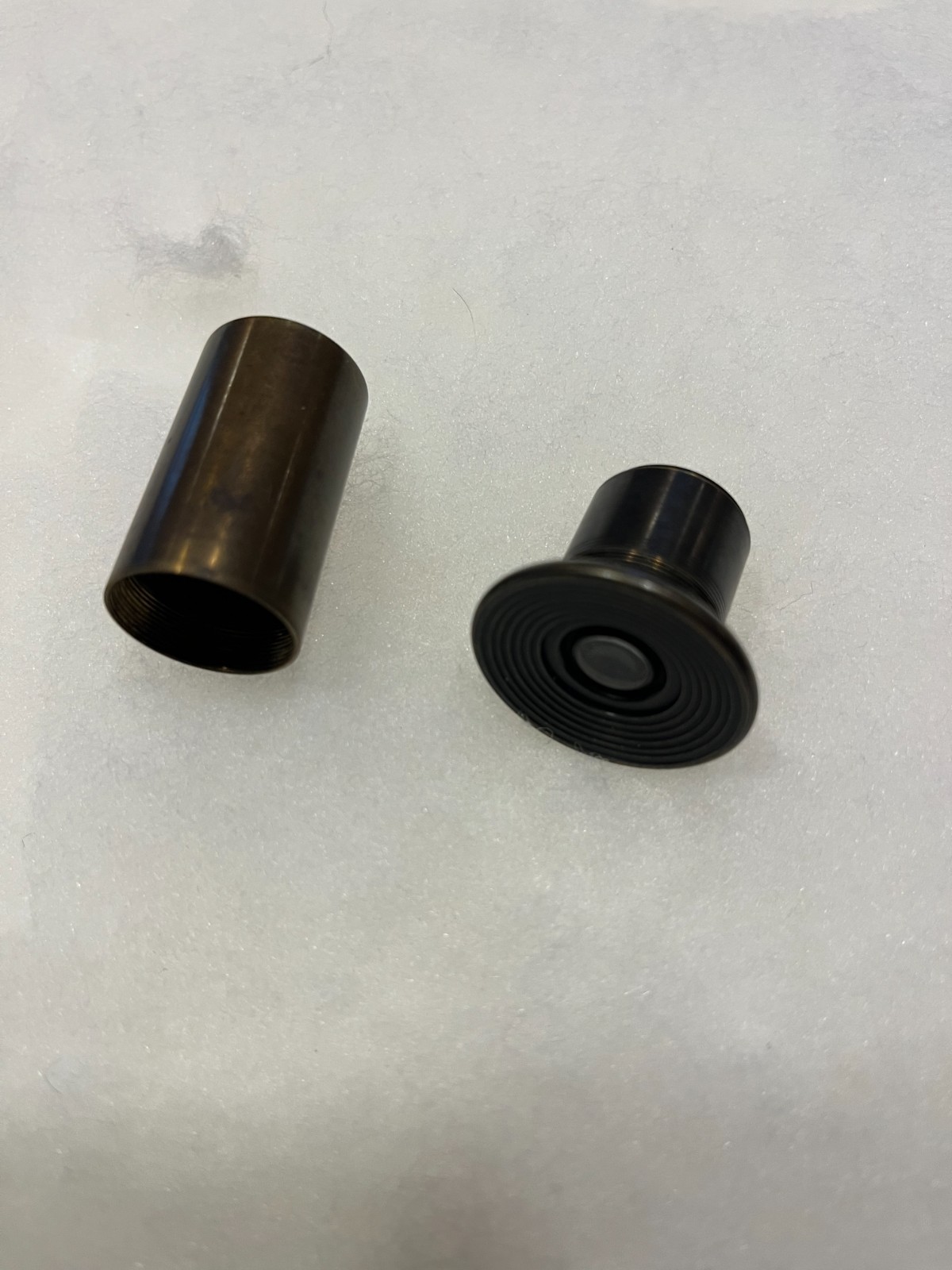 Old brass microscope lens ? Includes its own threaded brass storage tube