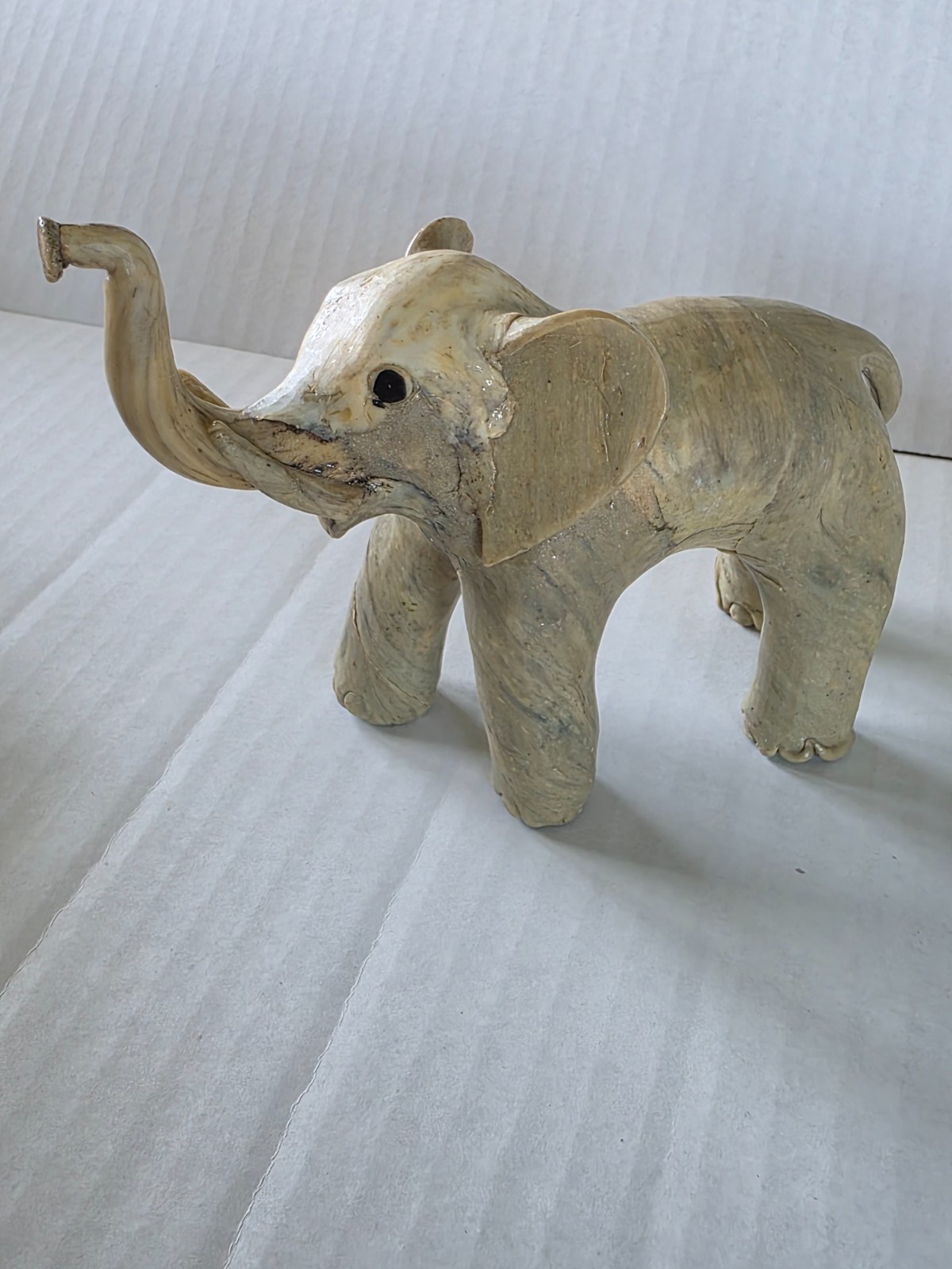 Three elephant figurines