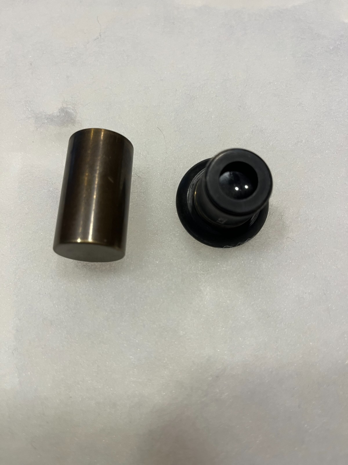 Old brass microscope lens ? Includes its own threaded brass storage tube