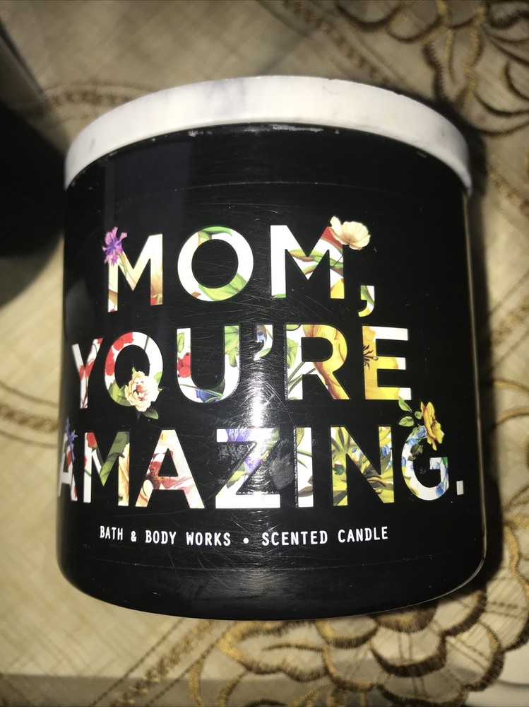 2 empty black candle jars with marble like lid