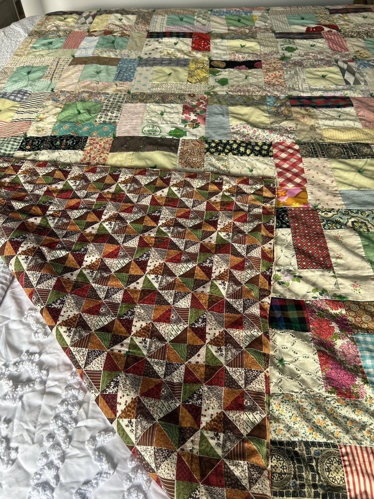 Handmade patchwork quilt with mixed fabric patterns
