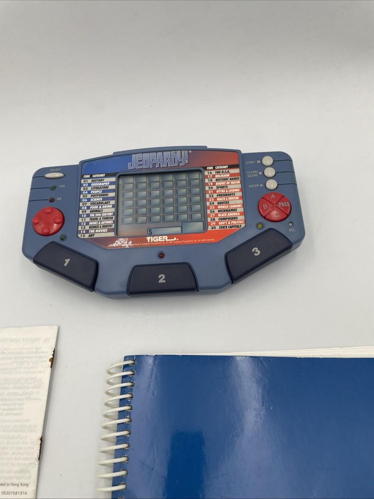 Tiger Electronics Jeopardy Hand Held Game 1995 with Answer Book & Manual E1