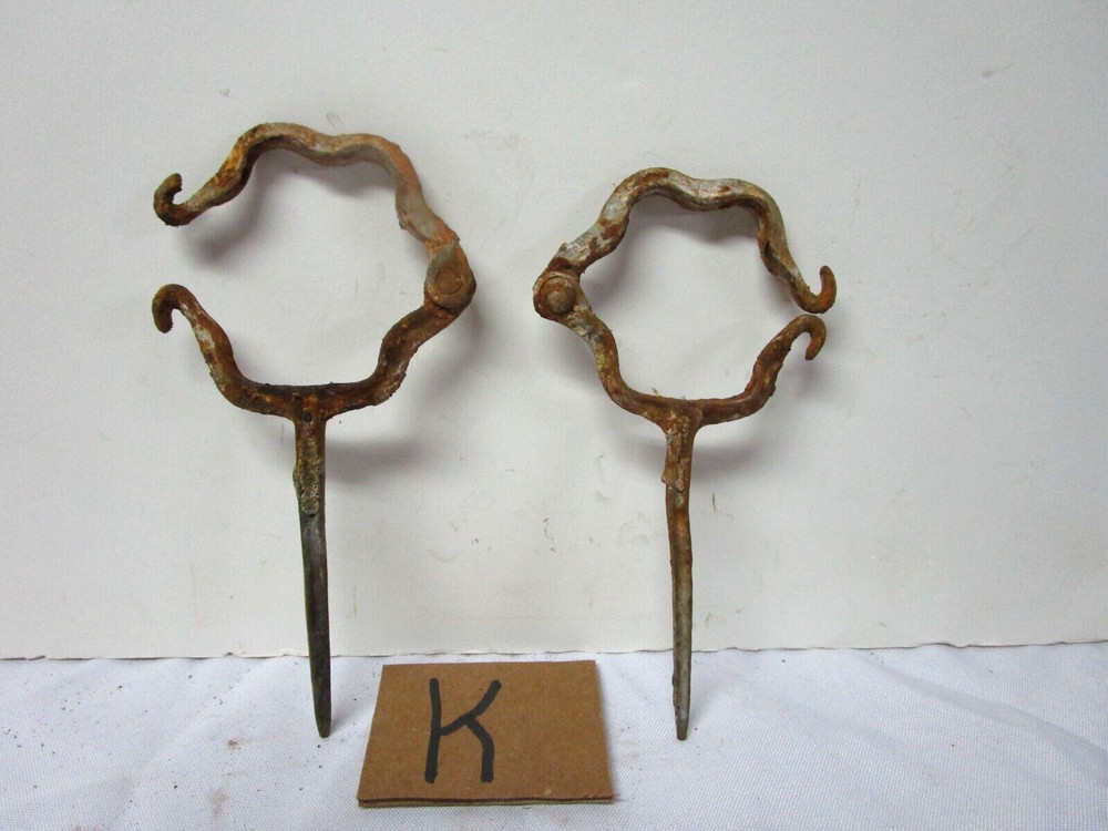 Two antique cast iron round gutter downspouts mounting brackets
