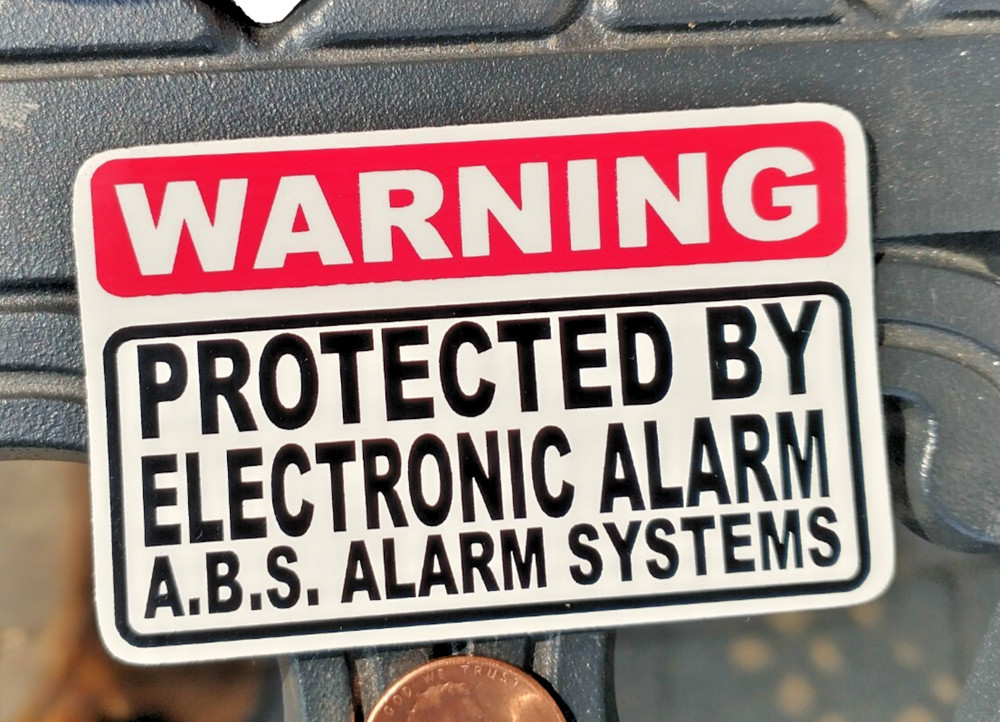 WARNING Protected BY ABS ELECTRONIC ALARM SYSTEMS sticker