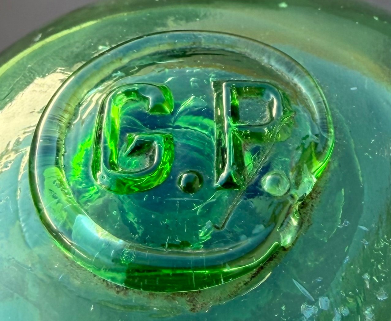 Glass fishing float marked G.P.