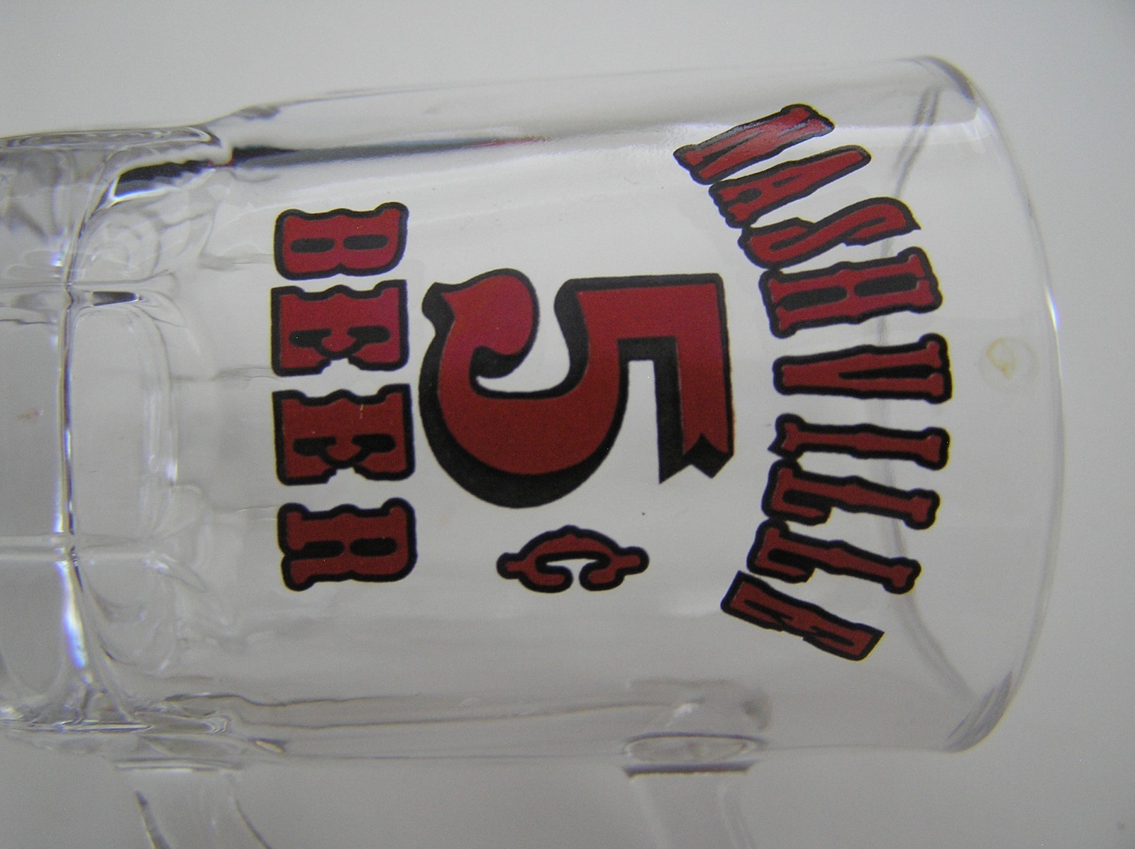 2 Souvenirs Shot Mugs: A Black Rumple Minze and A Clear Nashville 5cents Beer