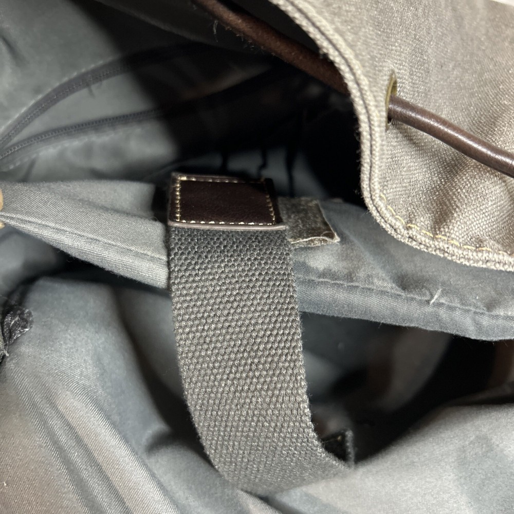 Cargoit Gray Canvas Backpack Magnetic Closures Pockets Straps and A Deep Inside