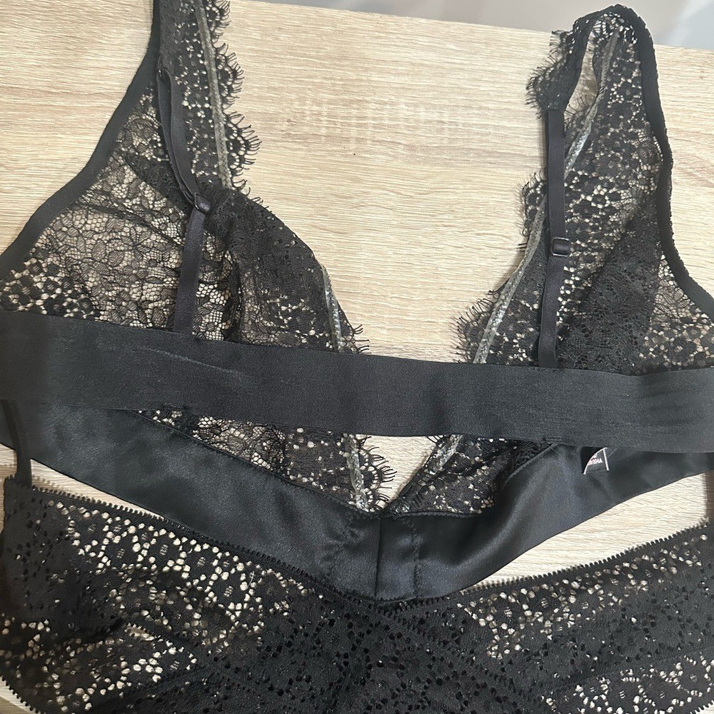 Victorias Secret Black Lace Thong Bodysuit. Size large.