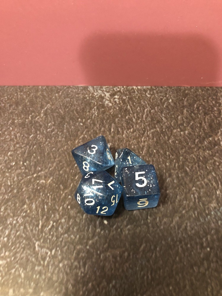 Two 4 Piece Multi Color Dice Sets