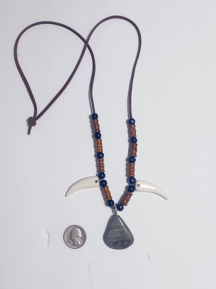 River Rock , Faux Wolf Teeth Beaded necklace .