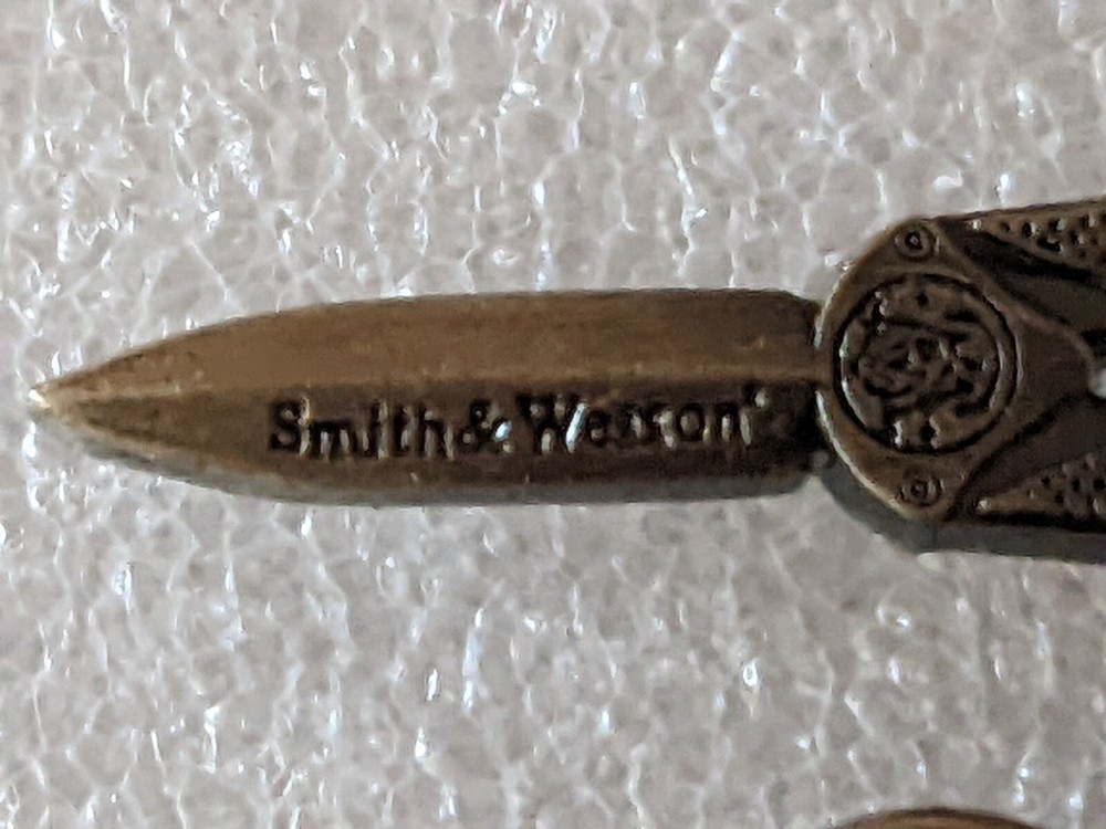 VINTAGE SMITH AND WESSON HAT/ LAPEL PIN