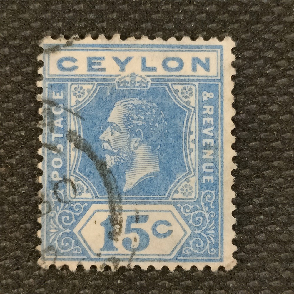 1912 15-cent blue stamp from Ceylon featuring King George V.
