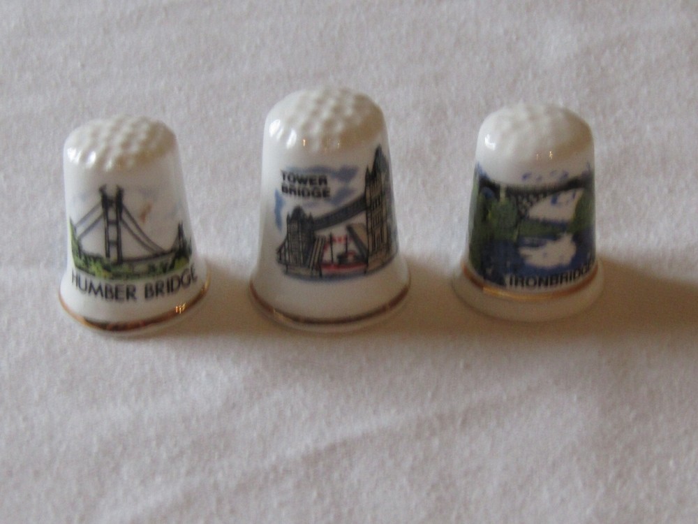 3 BONE CHINA THIMBLES DEPICTING TOWER BRIDGE, HUMBER BRIDGE & IRONBRIDGE.