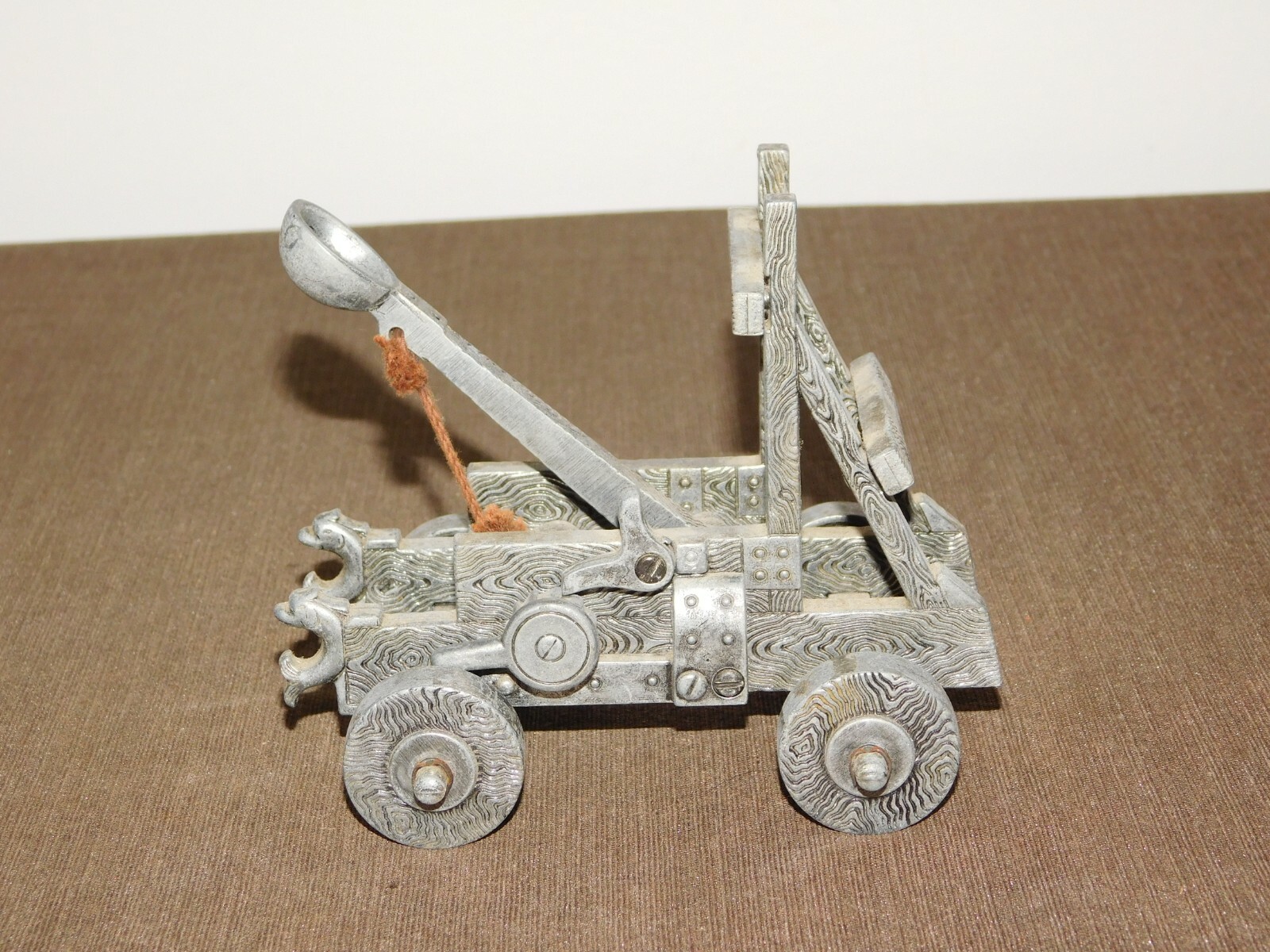 VINTAGE TOY 5" X 4" X 5 1/2" HIGH METAL CATAPULT