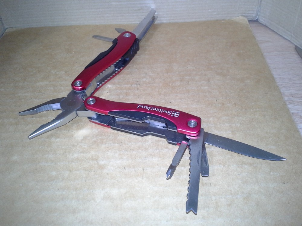 Switzerland Red Multitool Folding Pocket Pliers. VGC
