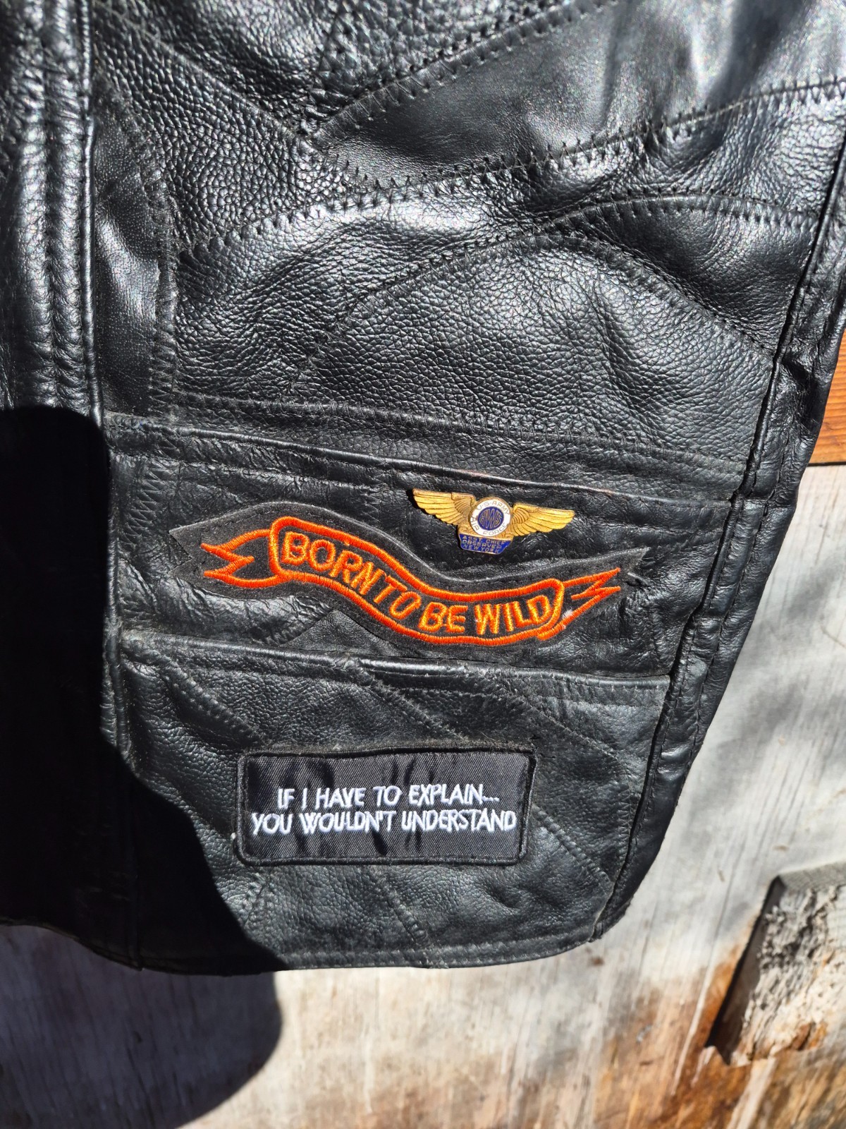Vintage harley hog leather vest filled with pins and has patches 2xl