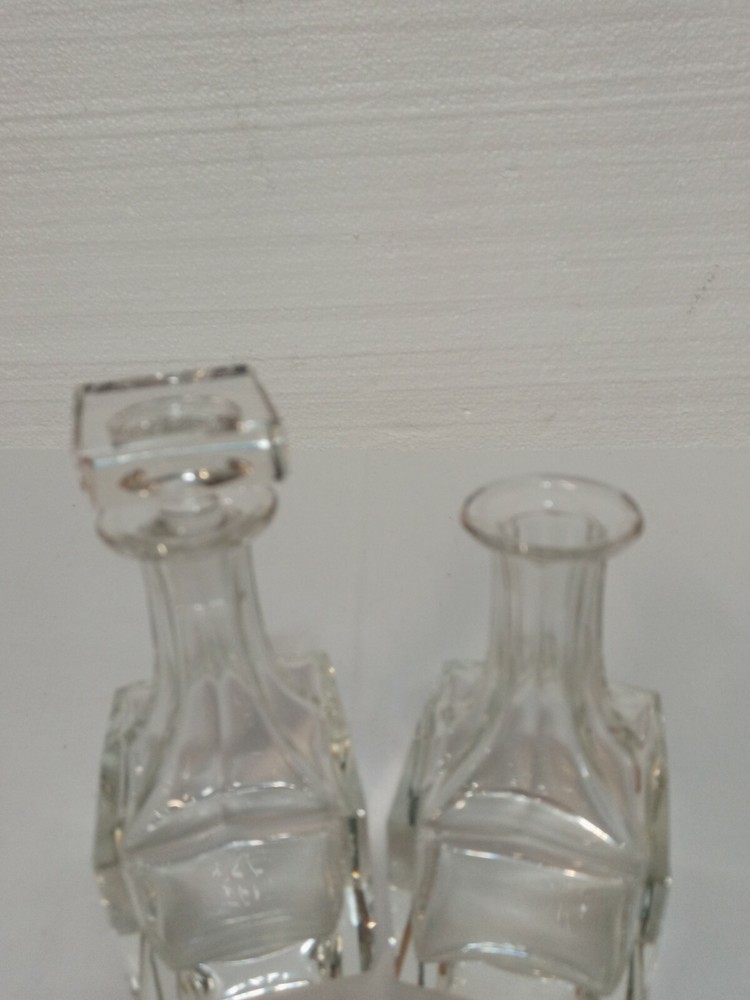 Two 4in Clear Glass Bottles One Stopper