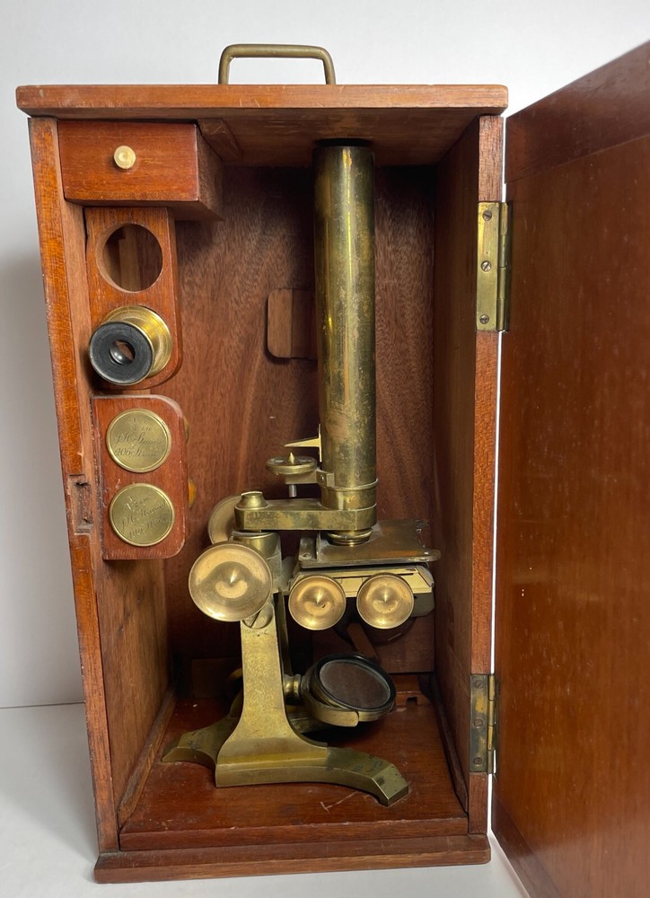 Antique Signed J.H. Steward microscope with case and some accessories.