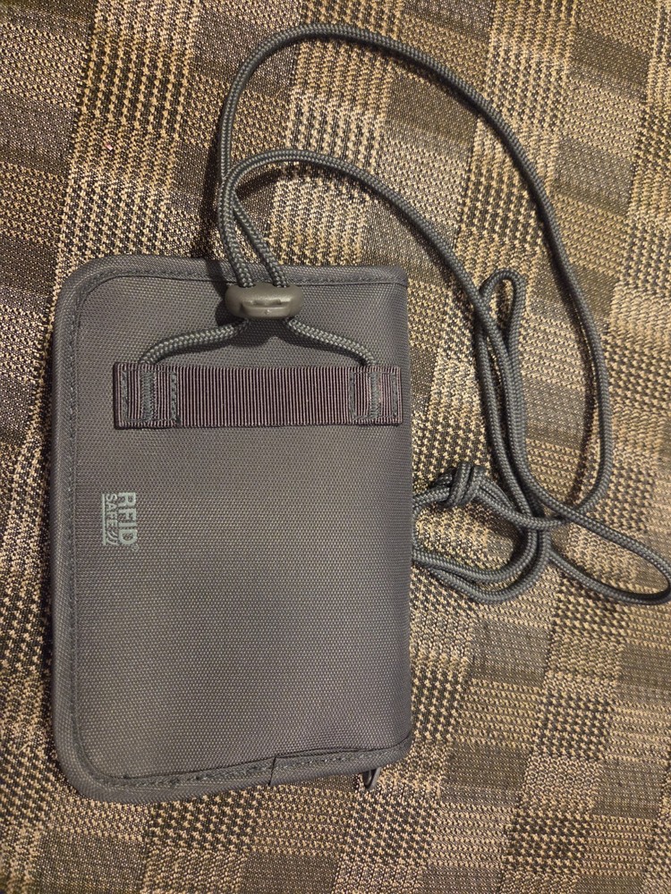 Pacsafe® RFIDsafe™ RFID blocking compact travel organizer, gray (orange inside)