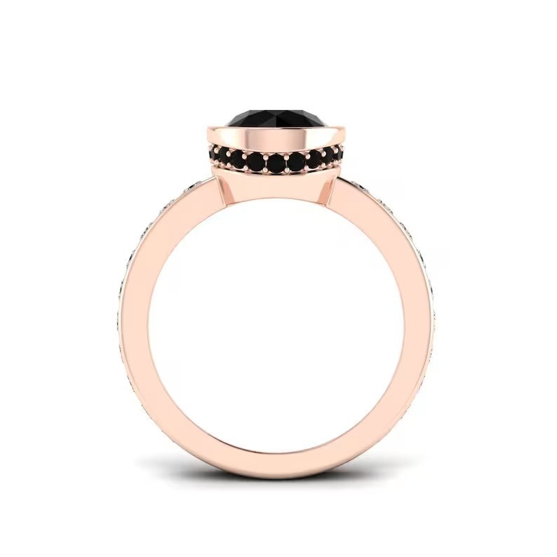 Make a statement with this stunning rose gold ring featuring a round black gemst