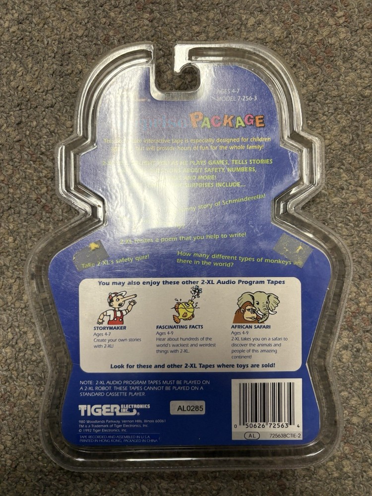 + Tiger Electronics 1992 2-XL Robot Surprise Package Audio Program Tape NIP
