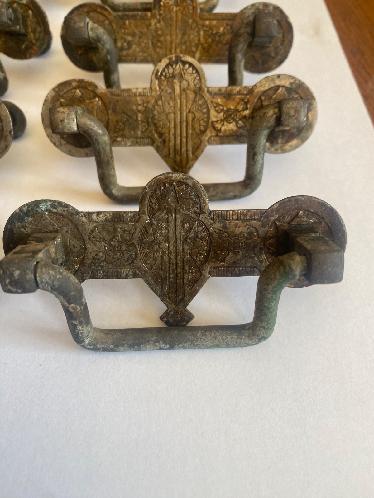 Eight- 2.5' center original brass Eastlake drawer pulls. Salvaged -not cleaned