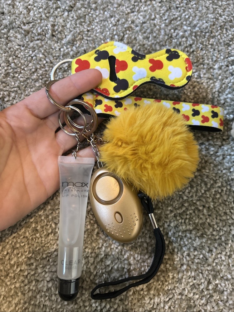 personal safety keychain set with several attached accessories.