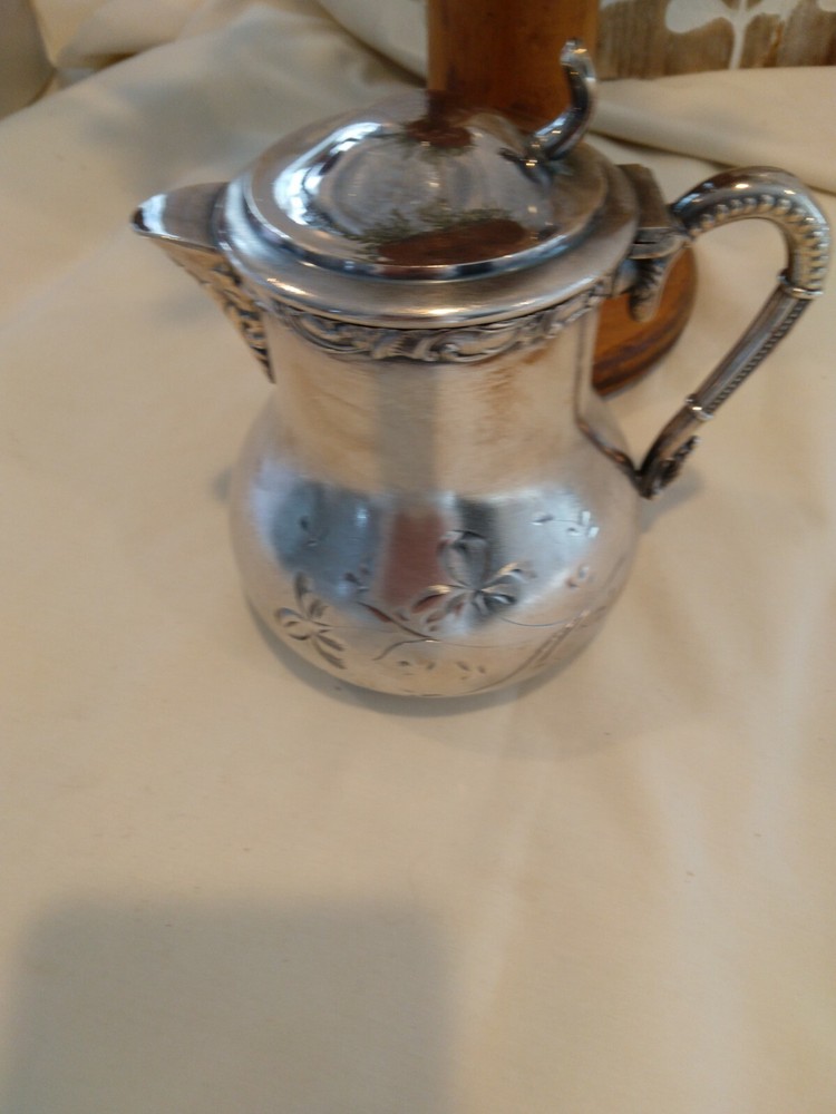 Beautiful small antique silver plated or silver pitcher.