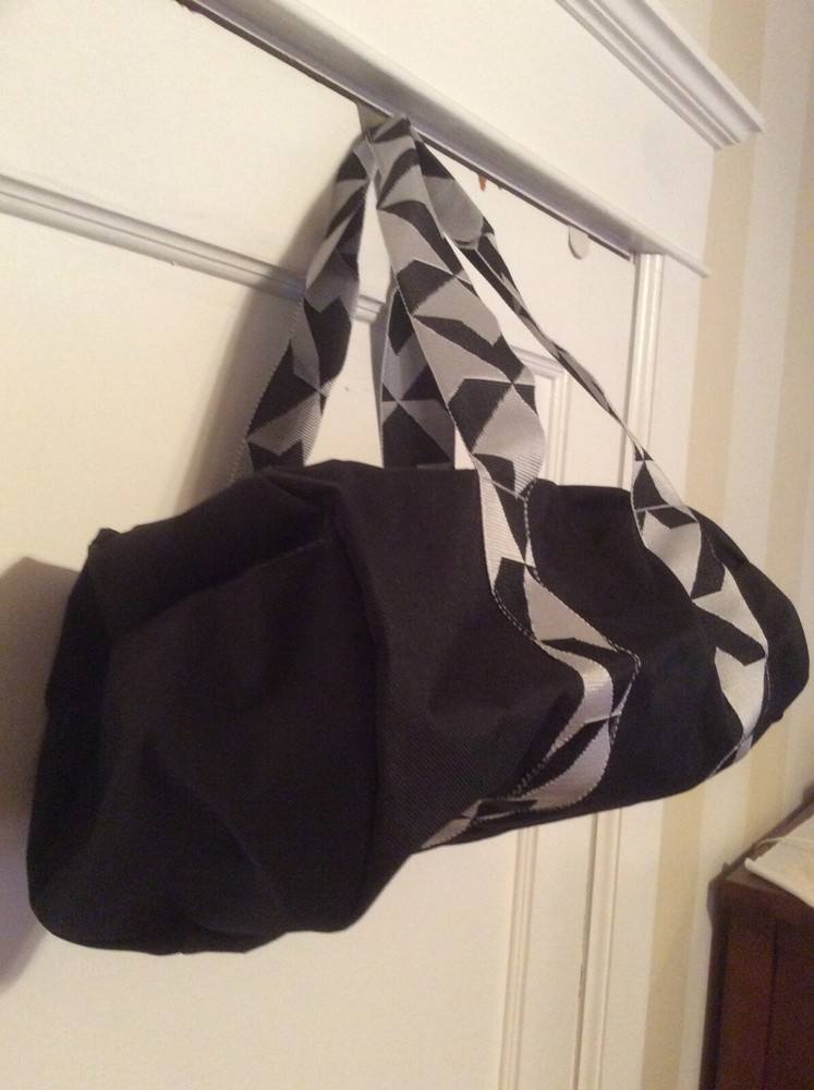 Twelve NYC black Duffel bag. Adjustable shoulder strap.