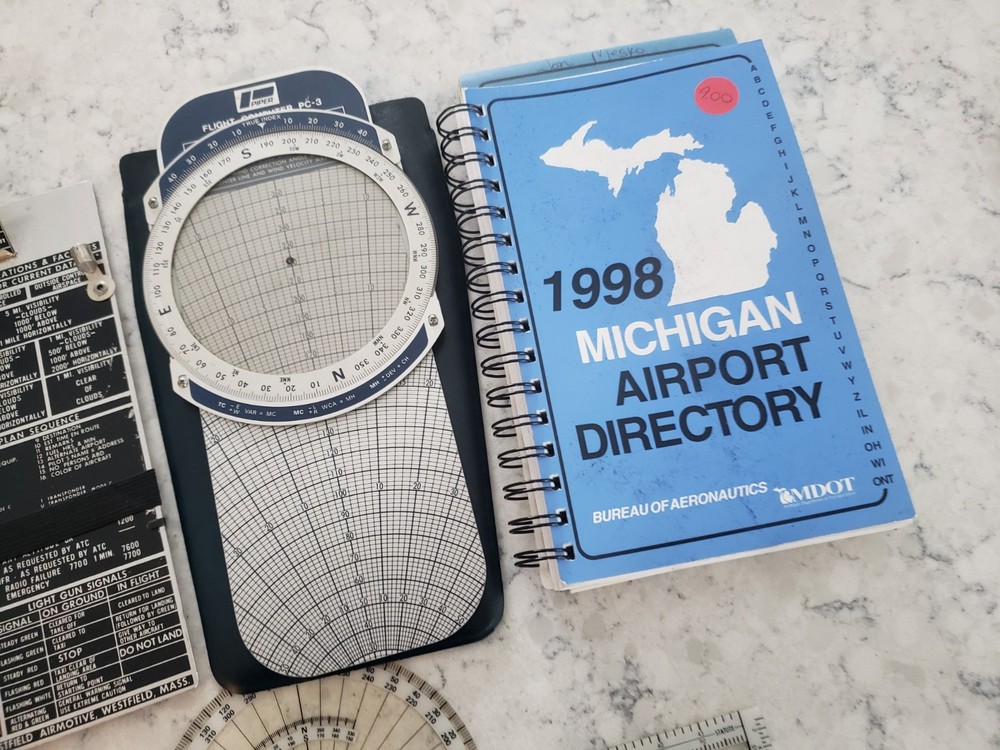 Sporty’s E6B electronic flight computer and Aviation slide computers plates