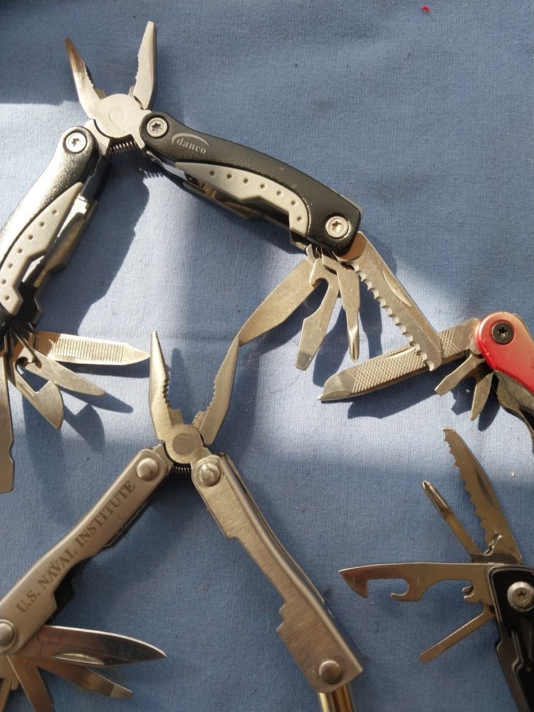 4 small multitudes with pliers knife scissors screwdriver's