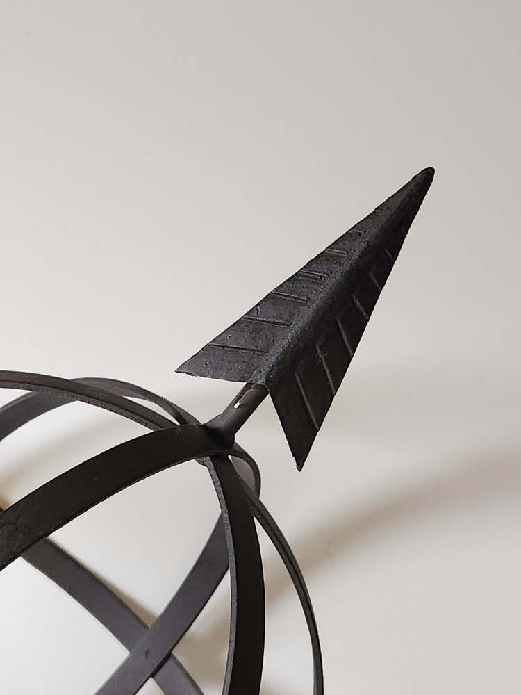 Metal Orb And Arrow Decor On Standing Base