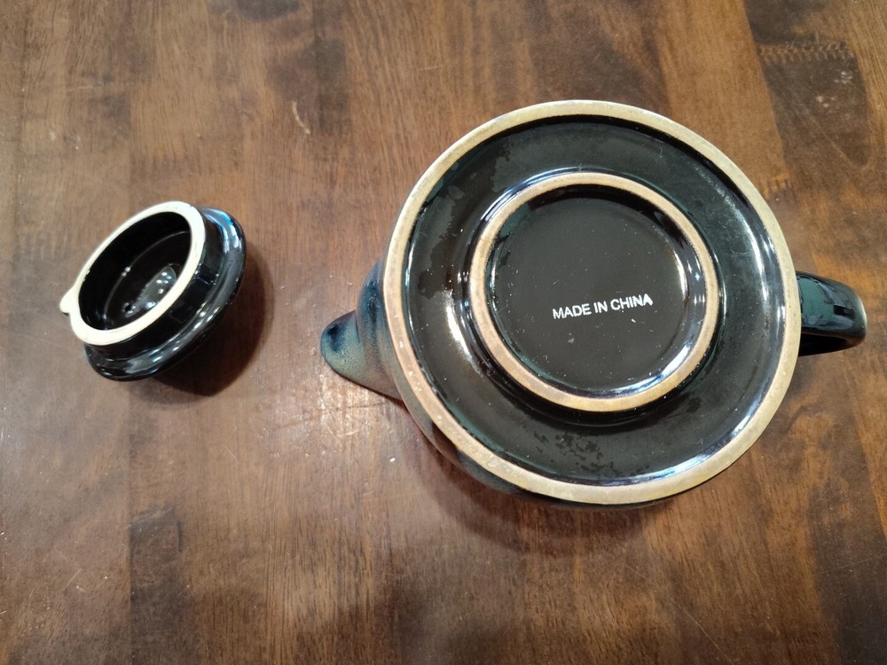 black with green ceramic teapot