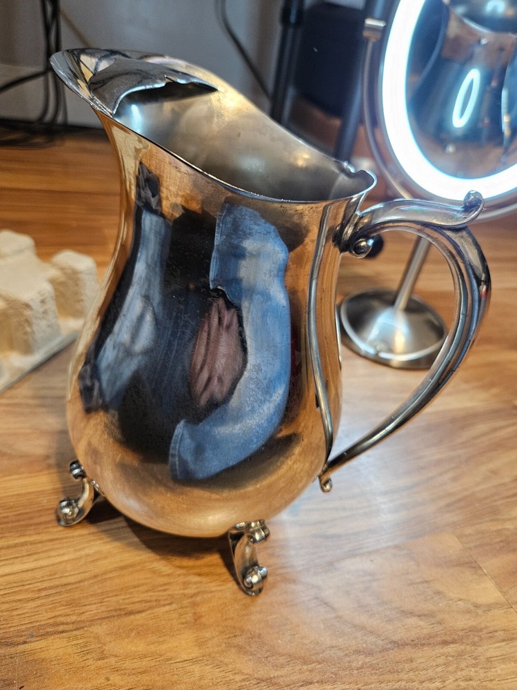 silver plated pitcher with pouring ice blocker