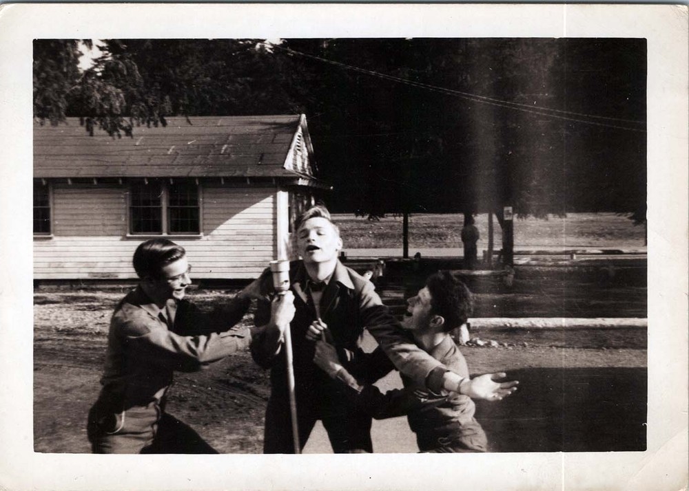 WW2 Photo of Two Soldiers Talking Between Barracks Buildings