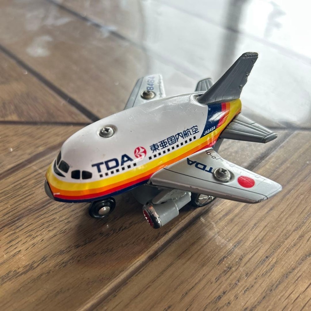 TDA miniature airplane tin