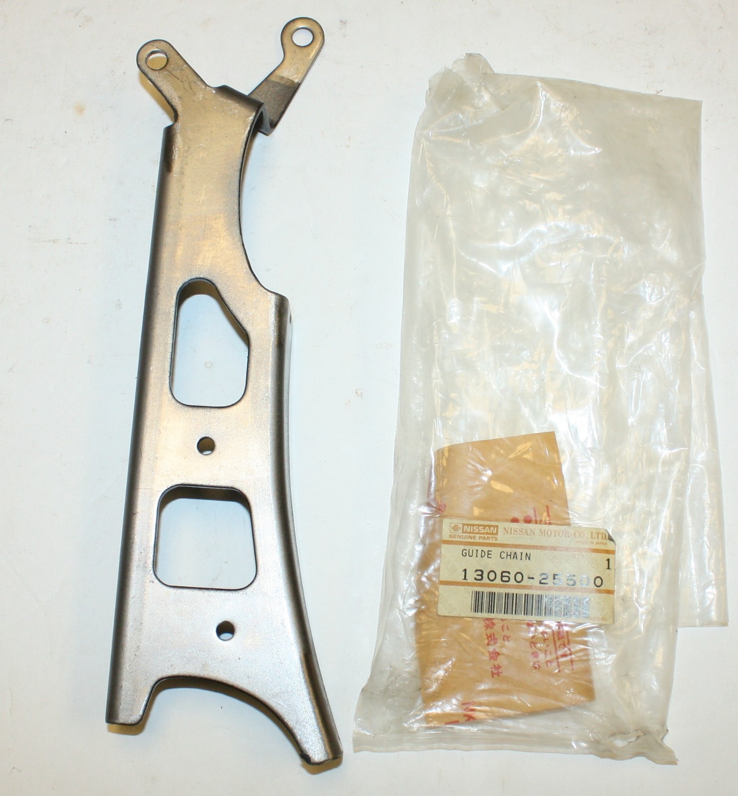 Datsun 2000 Roadster Upper Timing Chain Guide: Nissan Part 13060-25500