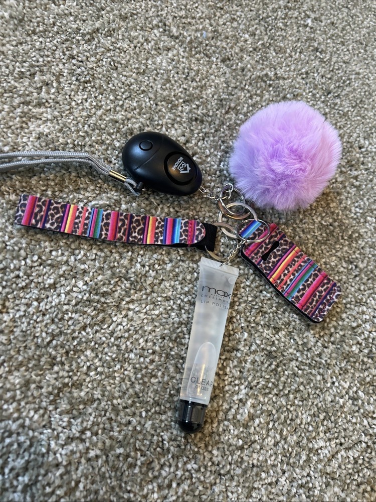 Personal Safety Keychain Set with Several Attached Accessories.