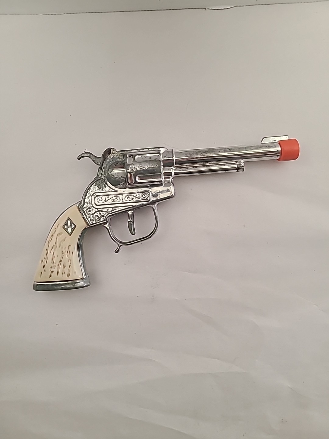 Vintage Halco Cowboy Die Cast Toy Cap Gun with Orange Plug & White Grip Handle—