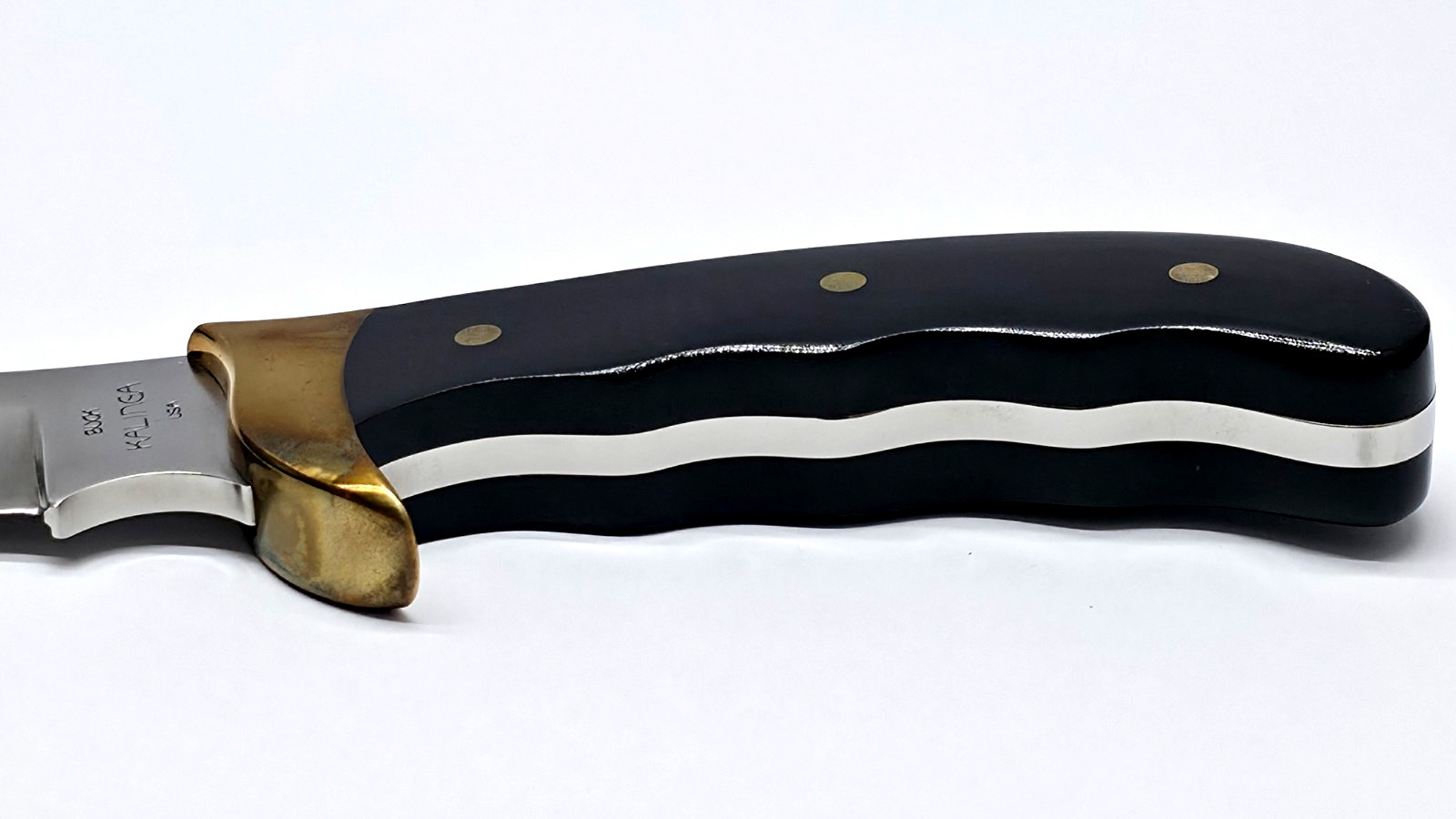 Buck Kalinga knife with black handle and brown leather sheath