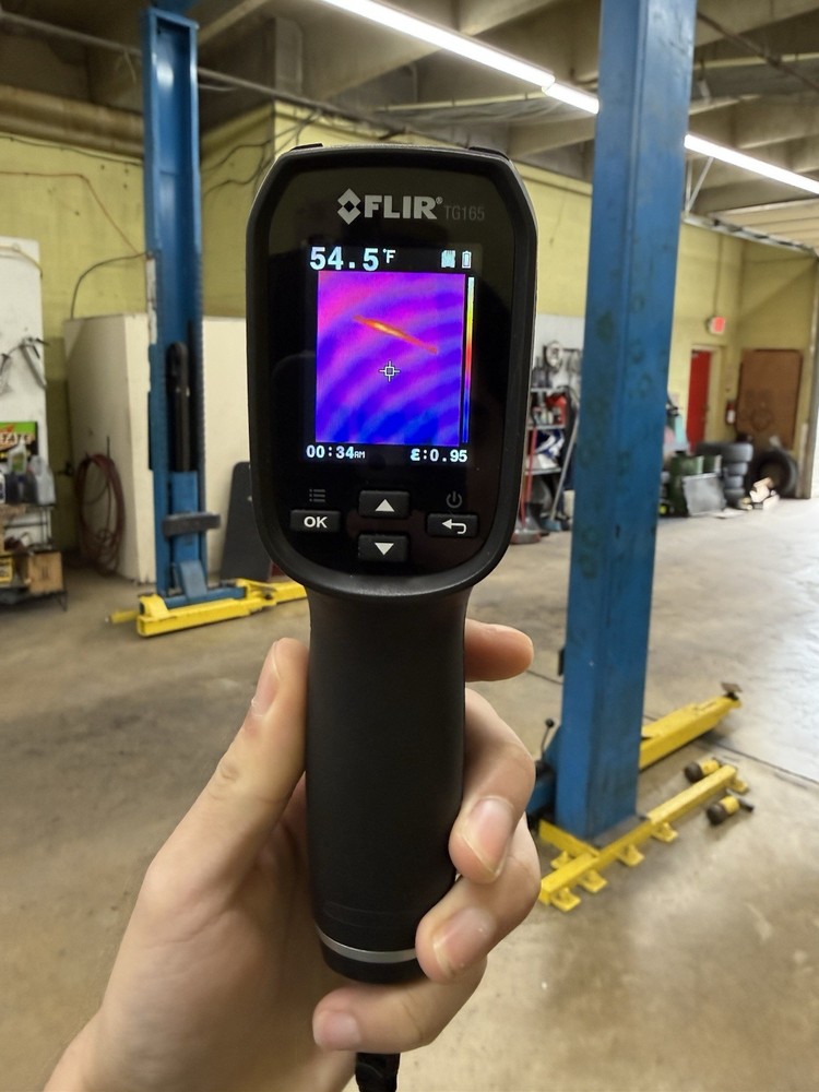 FLIR TG165 thermal camera, matte black with gray bezel.