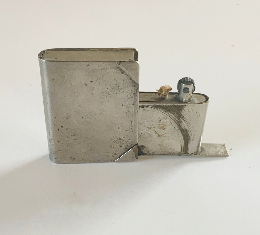 WWII era trench art lighter book