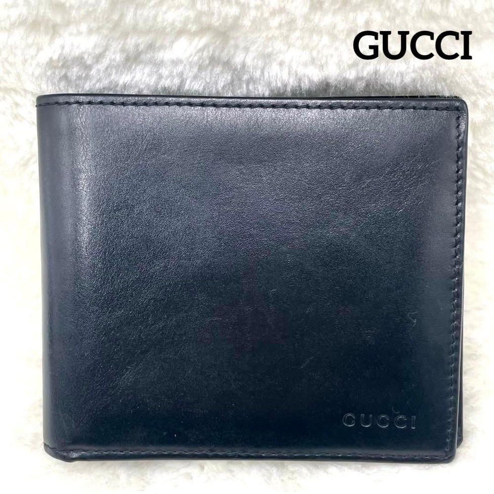 GUCCI Embossed Logo Black Folding Wallet