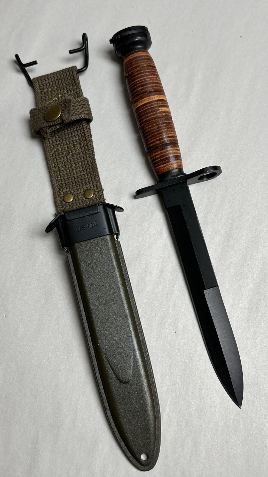M1 CARBINE BAYONET LEATHER HANDLE WITH SCABBARD.