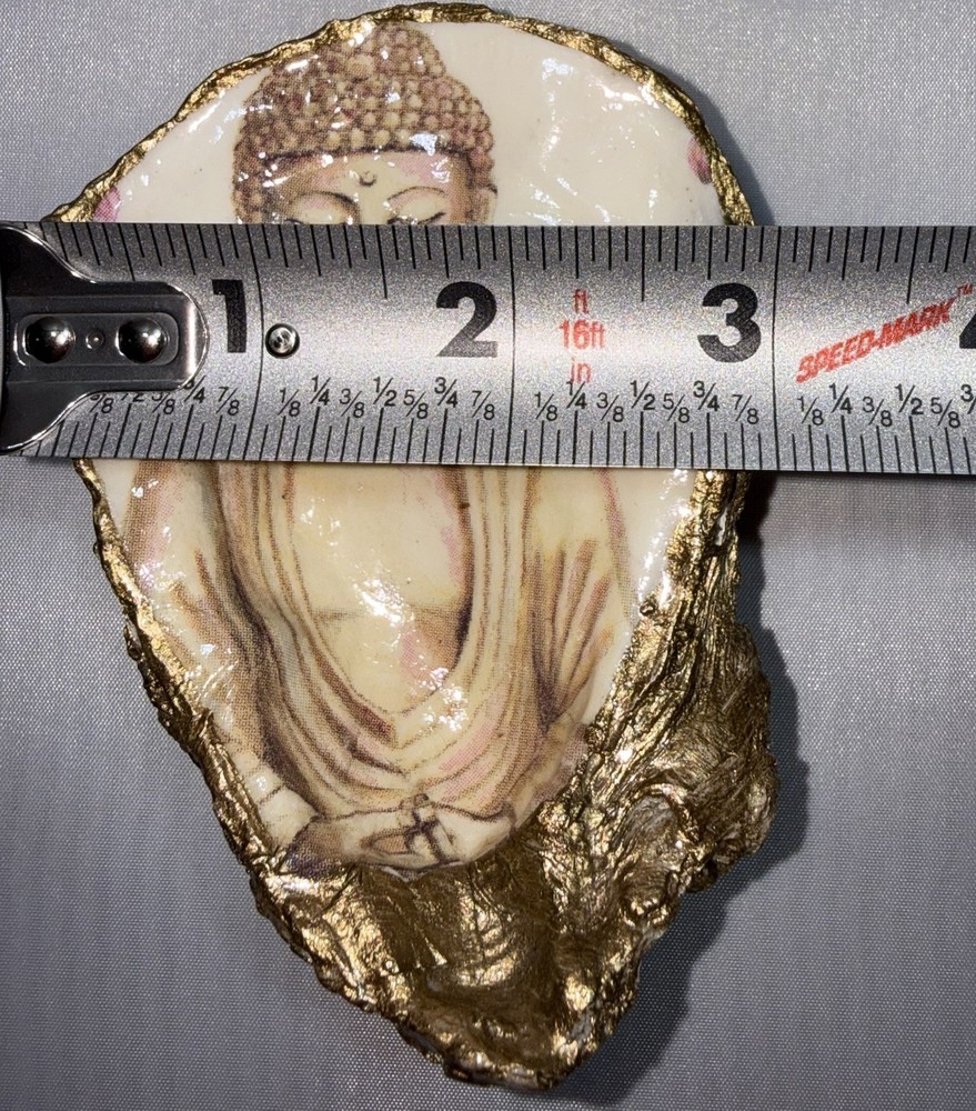 Decoupaged oyster shell ring dish featuring a Buddha image with gold-leaf edging