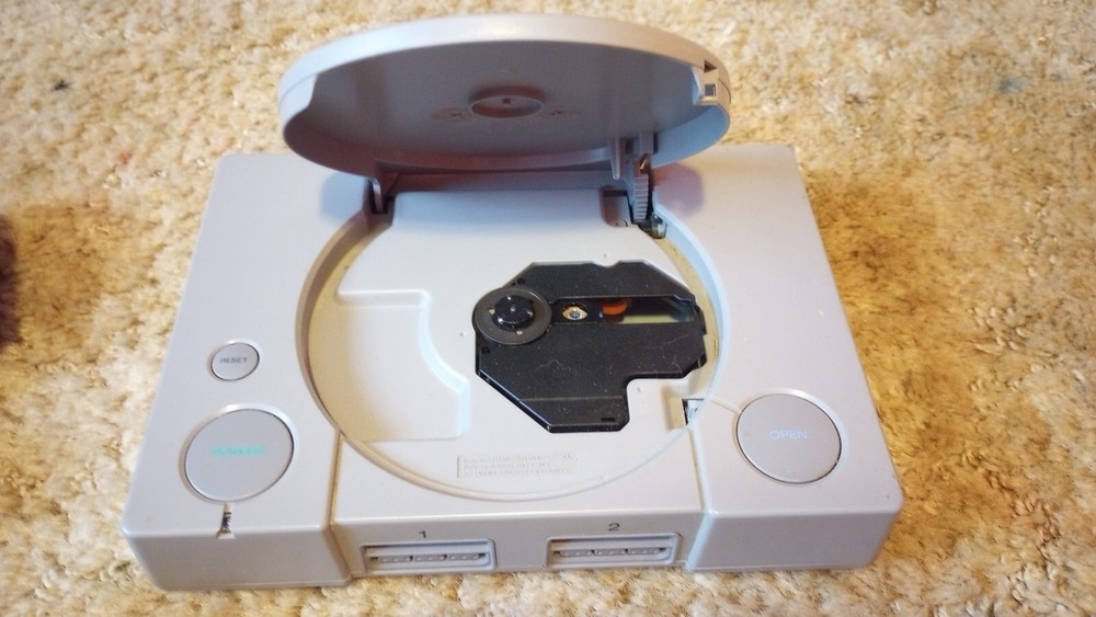 PlayStation 1 console with games